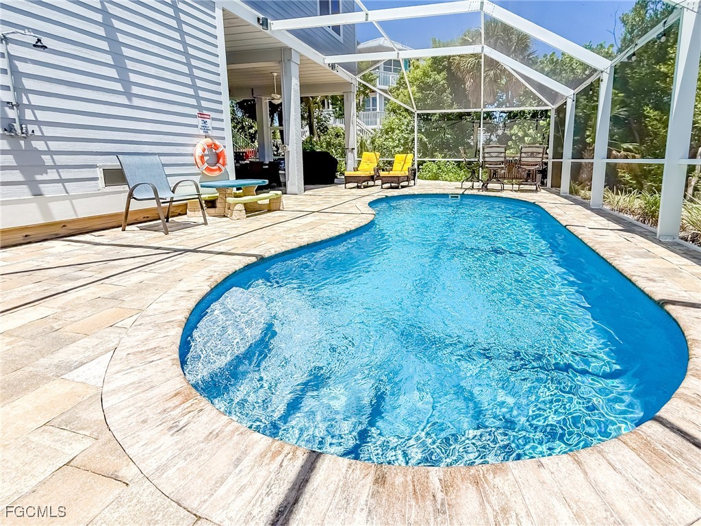 631 Rum Road Upper Captiva, FL 33924 - Photo 18 of 50 a view of a swimming pool with a patio