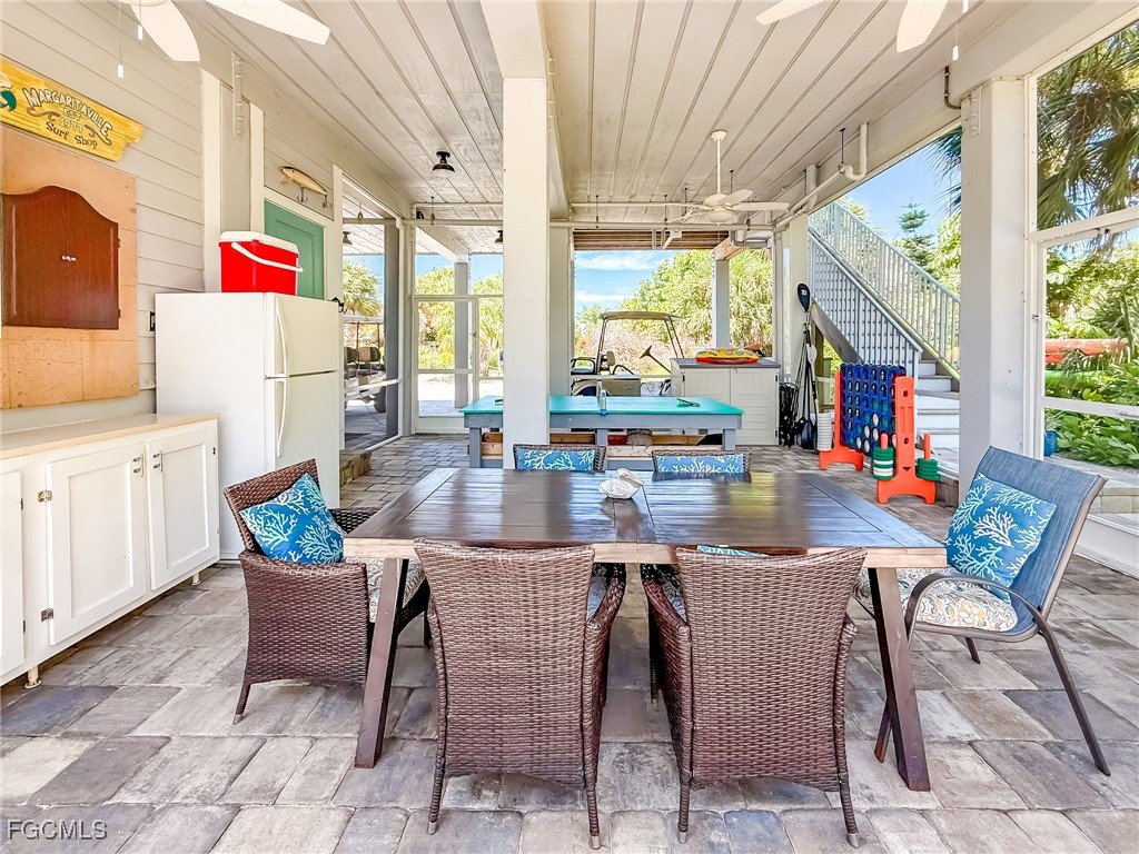 631 Rum Road Upper Captiva, FL 33924 - Photo 19 of 50 a outdoor dining space with furniture and outdoor view