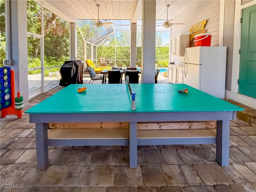 631 Rum Road Upper Captiva, FL 33924 - Photo 20 of 50 a room with pool table and windows