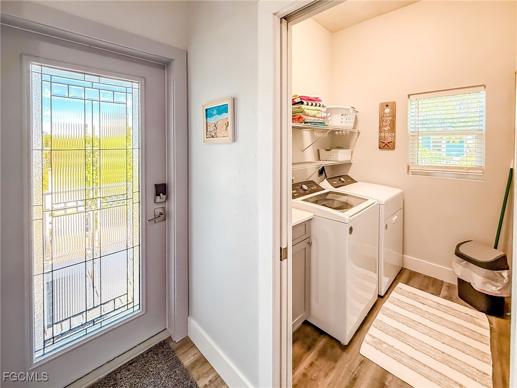 631 Rum Road Upper Captiva, FL 33924 - Photo 25 of 50 a view of a kitchen with fridge and wooden floor