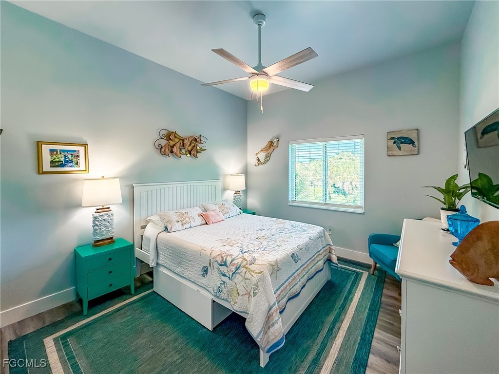 631 Rum Road Upper Captiva, FL 33924 - Photo 29 of 50 a bedroom with a bed and a window