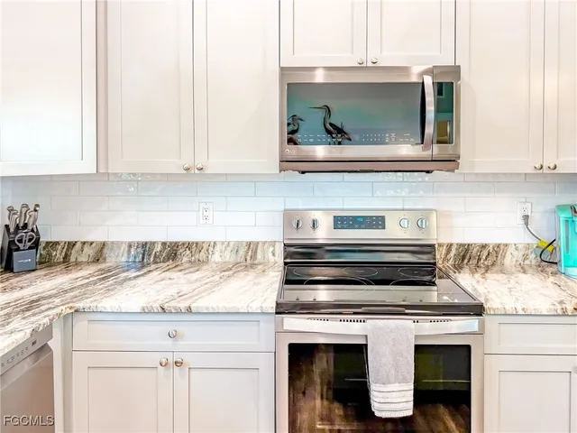 a kitchen with a stove and a microwave