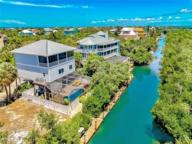 a aerial view of a house with a ocean view