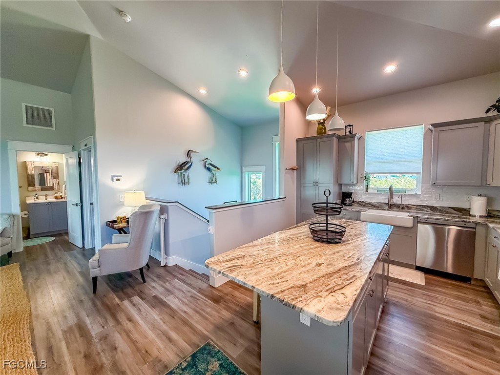 631 Rum Road Upper Captiva, FL 33924 - Photo 43 of 50 a kitchen with a stove and a wooden floor