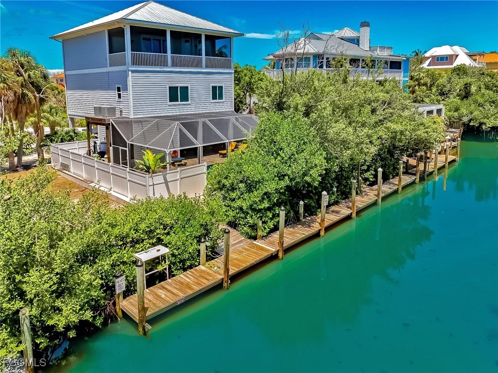 631 Rum Road Upper Captiva, FL 33924 - Photo 48 of 50 a view of a house with a yard