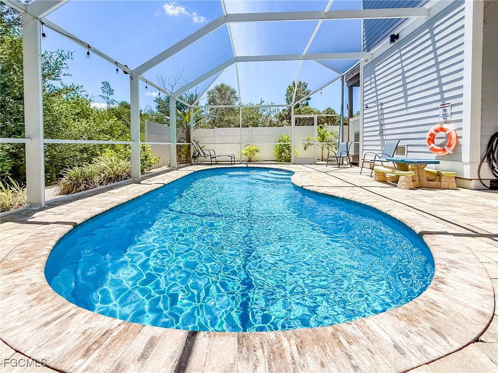 631 Rum Road Upper Captiva, FL 33924 - Photo 5 of 50 a view of a living room and floor to ceiling window or kitchen