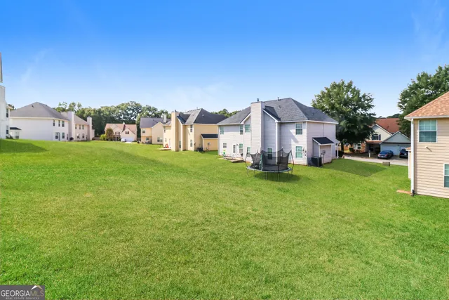 a view of a house with a big yard