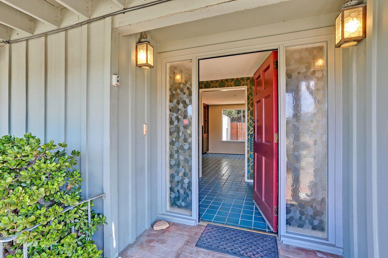 3235 Rio Road Carmel, CA 93923 - Photo 11 of 40 a view of a hallway with wooden floor and front door