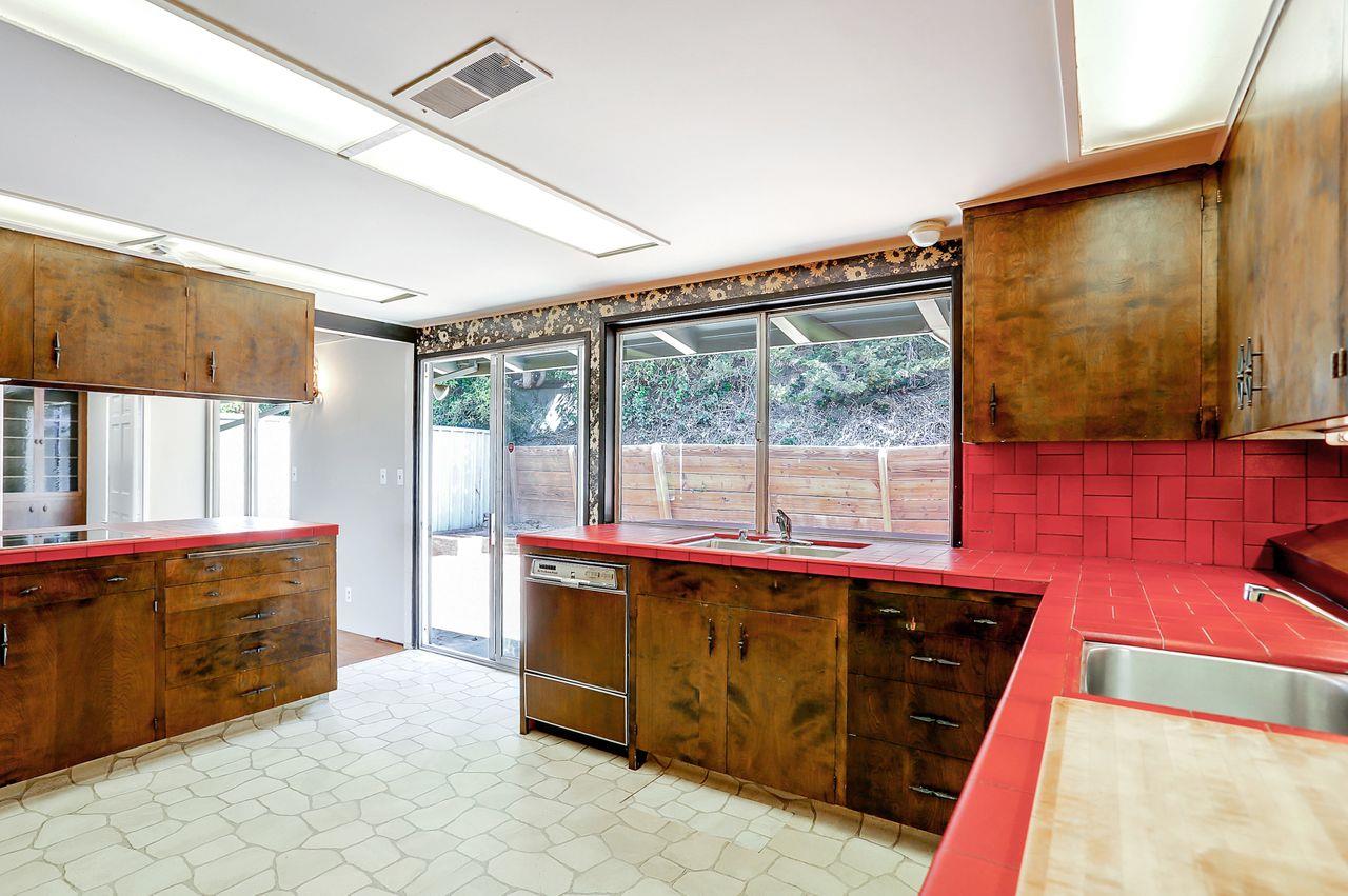3235 Rio Road Carmel, CA 93923 - Photo 19 of 40 a living room with a couch and a flat screen tv