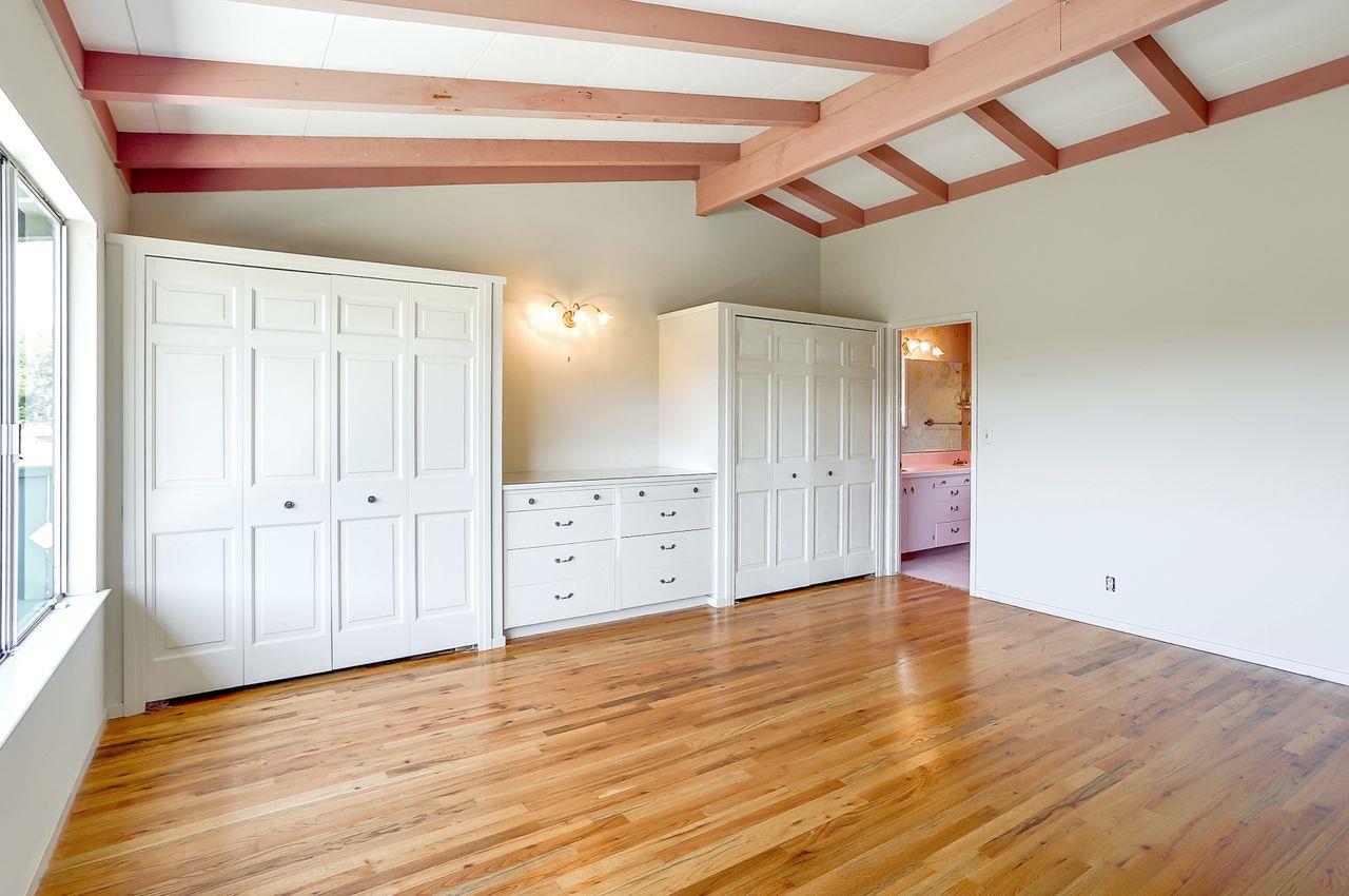 3235 Rio Road Carmel, CA 93923 - Photo 24 of 40 a view of an empty room with wooden floor