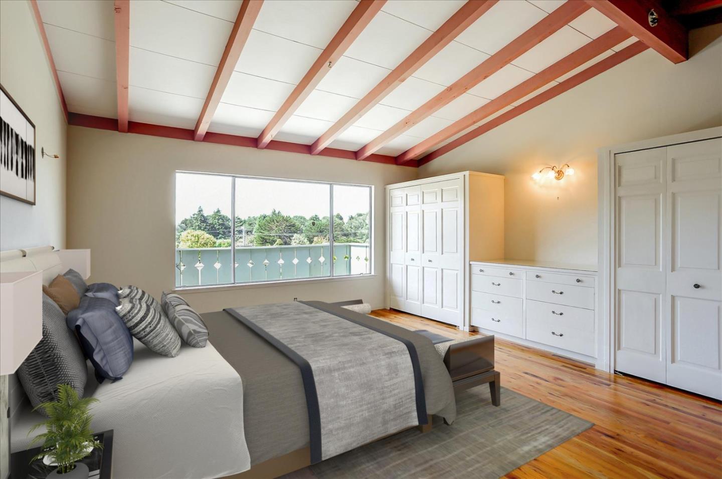 3235 Rio Road Carmel, CA 93923 - Photo 26 of 40 a bed room with a bed and a large window