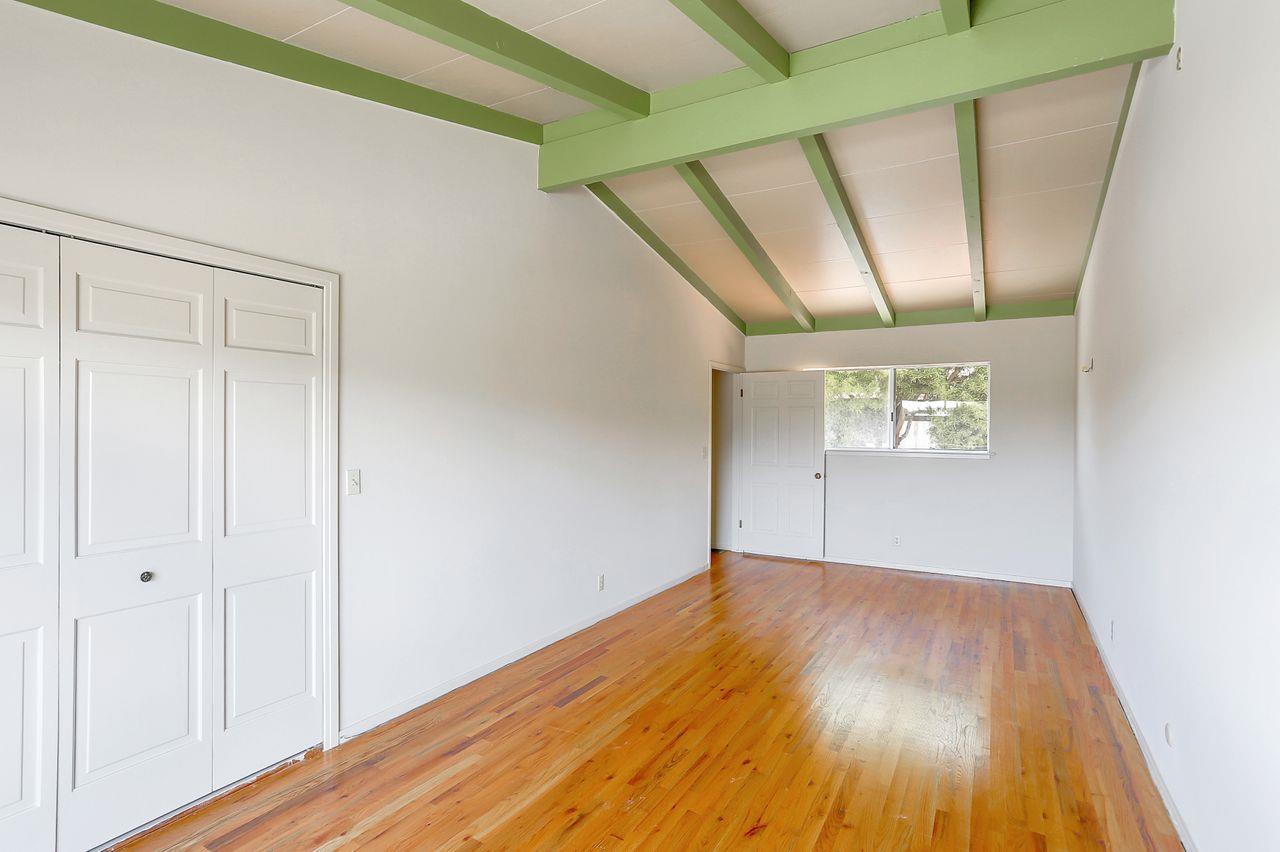 3235 Rio Road Carmel, CA 93923 - Photo 27 of 40 a view of an empty room with wooden floor