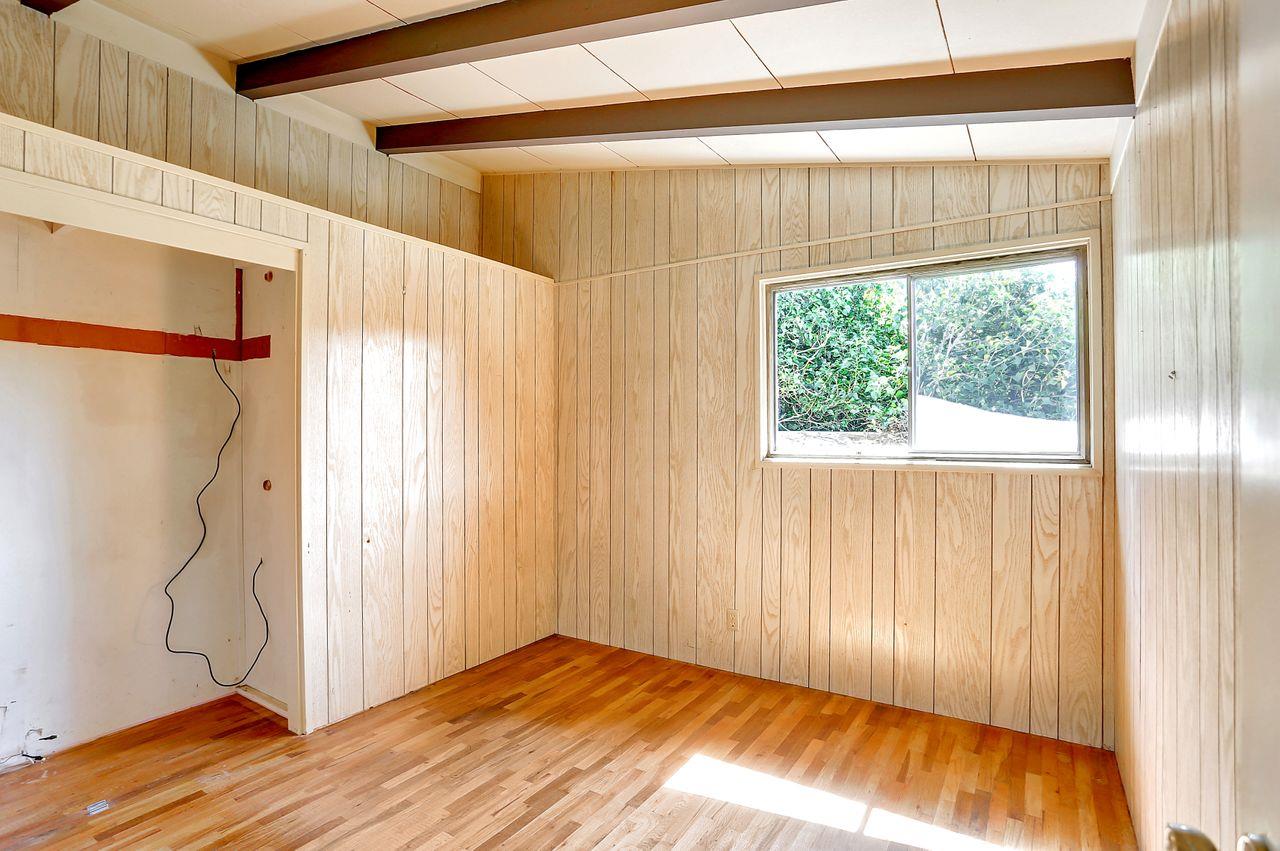 3235 Rio Road Carmel, CA 93923 - Photo 28 of 40 a view of a room with a window and wooden floor
