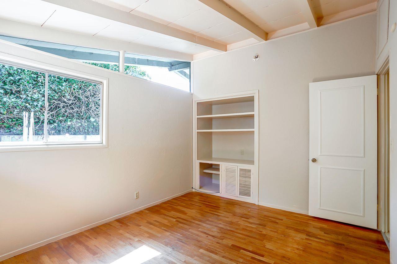 3235 Rio Road Carmel, CA 93923 - Photo 30 of 40 a view of empty room with wooden floor and fan