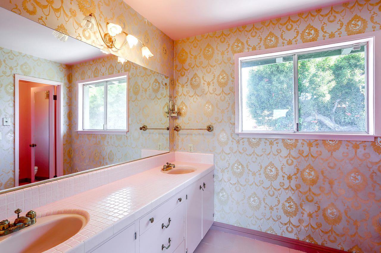 3235 Rio Road Carmel, CA 93923 - Photo 32 of 40 a bathroom with a tub sink and mirror