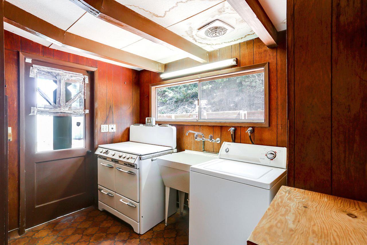 3235 Rio Road Carmel, CA 93923 - Photo 33 of 40 a utility room with dryer and washer