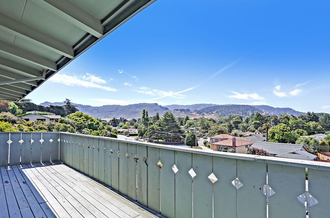 3235 Rio Road Carmel, CA 93923 - Photo 35 of 40 a balcony with wooden floor and city view