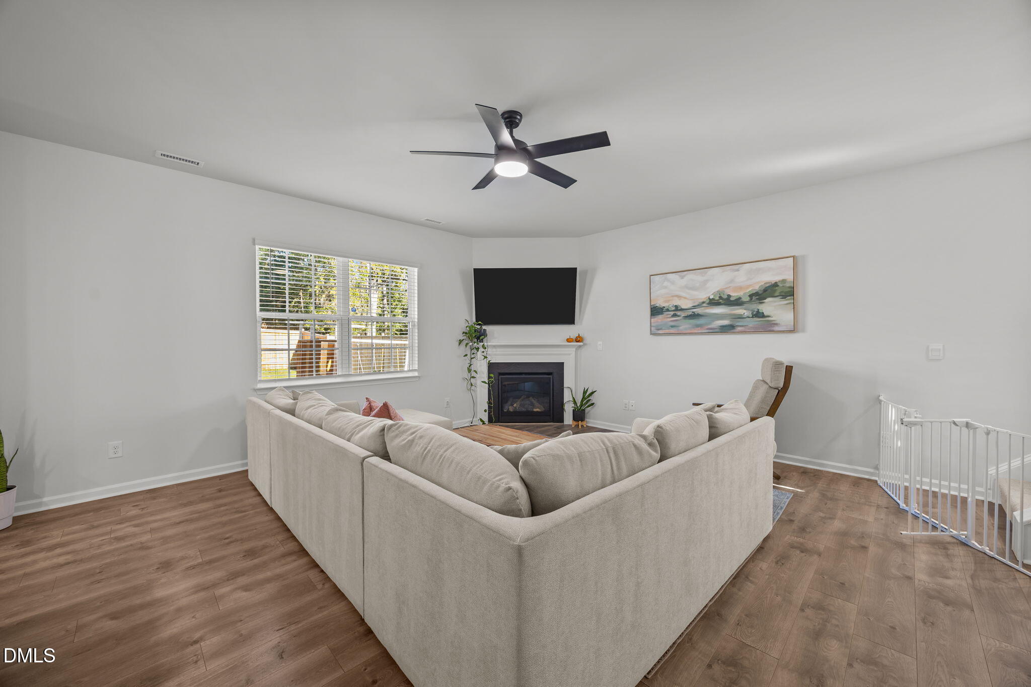 2117 Fletchers Ridge Drive Durham, NC 27703 - Photo 13 of 46 a living room with furniture and a flat screen tv