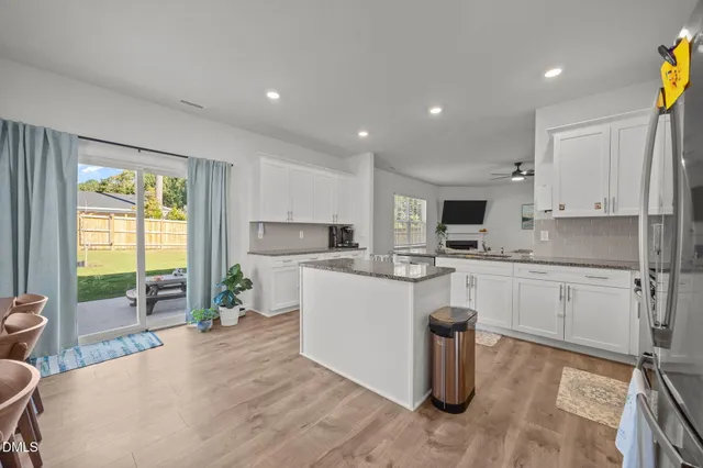 a kitchen with a sink stove and refrigerator