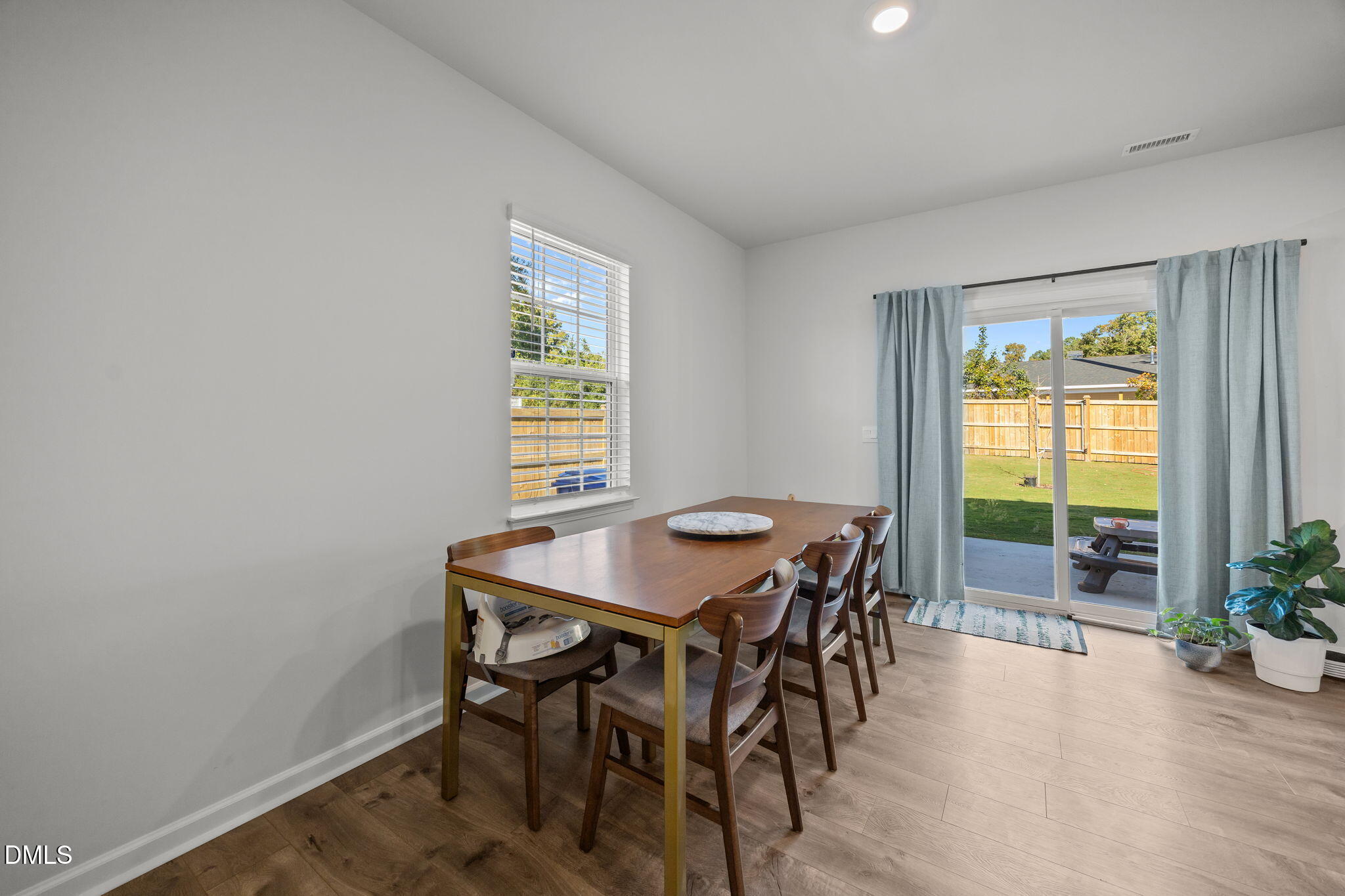 2117 Fletchers Ridge Drive Durham, NC 27703 - Photo 20 of 46 a view of a dining room with furniture window and outside view