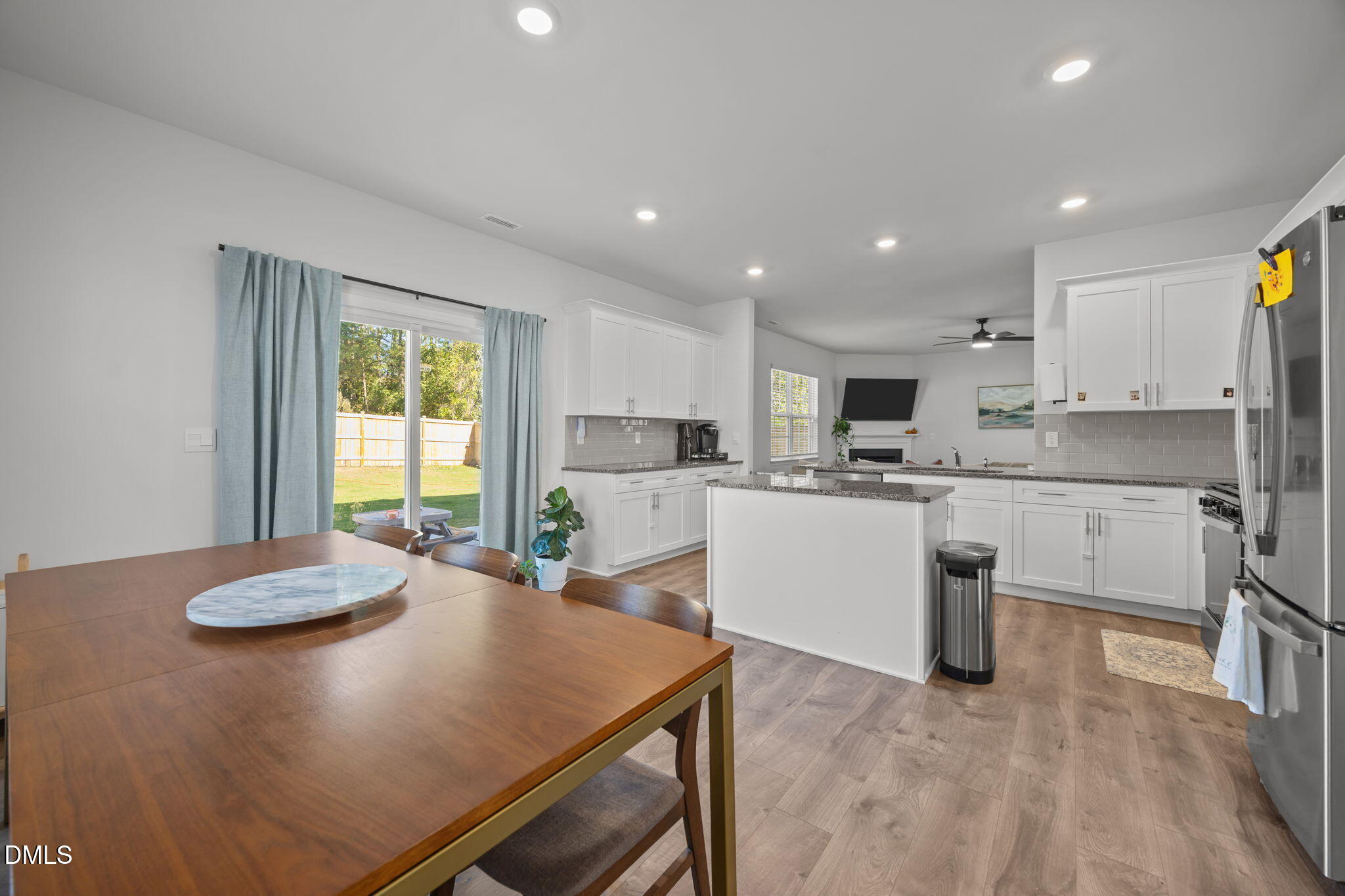 2117 Fletchers Ridge Drive Durham, NC 27703 - Photo 21 of 46 a kitchen with cabinets and wooden floor
