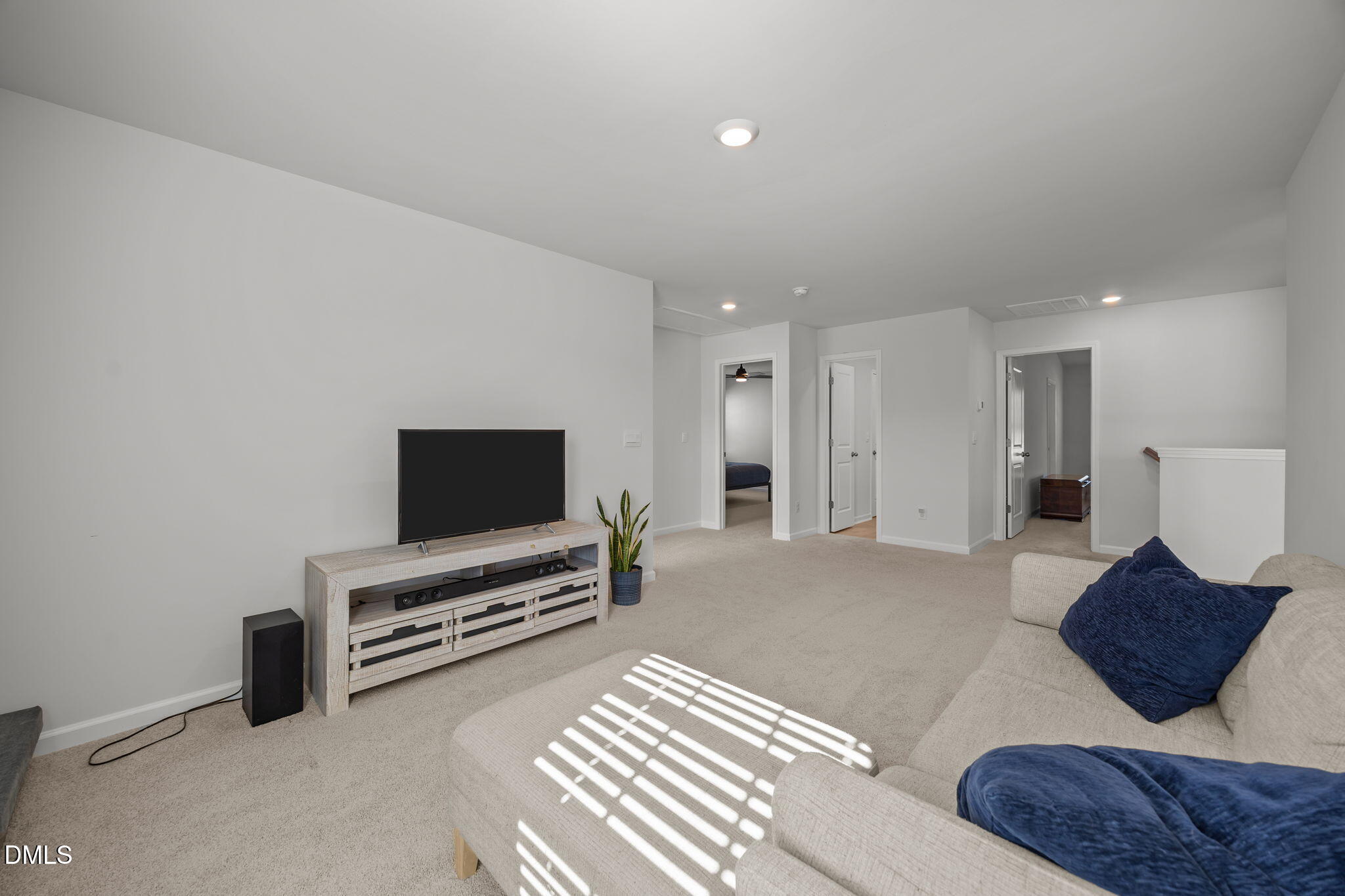 2117 Fletchers Ridge Drive Durham, NC 27703 - Photo 25 of 46 a living room with furniture and a flat screen tv