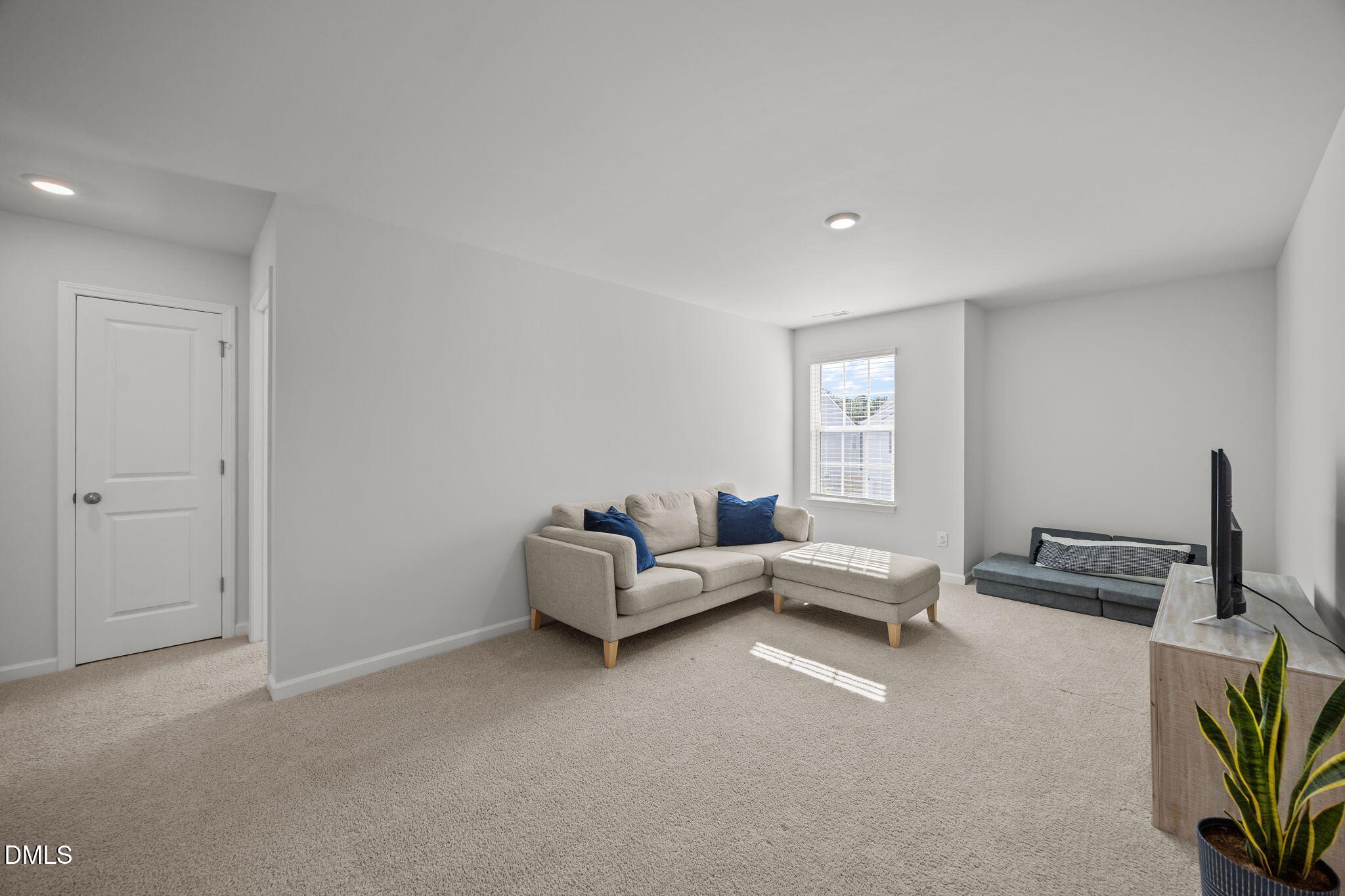 2117 Fletchers Ridge Drive Durham, NC 27703 - Photo 26 of 46 a living room with furniture and a window