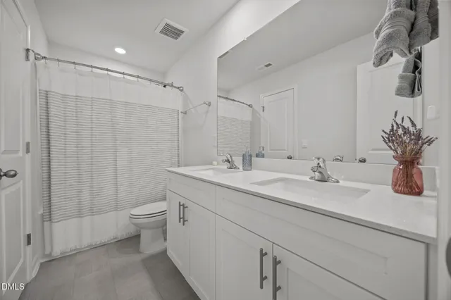 a bed room with a bed and a window