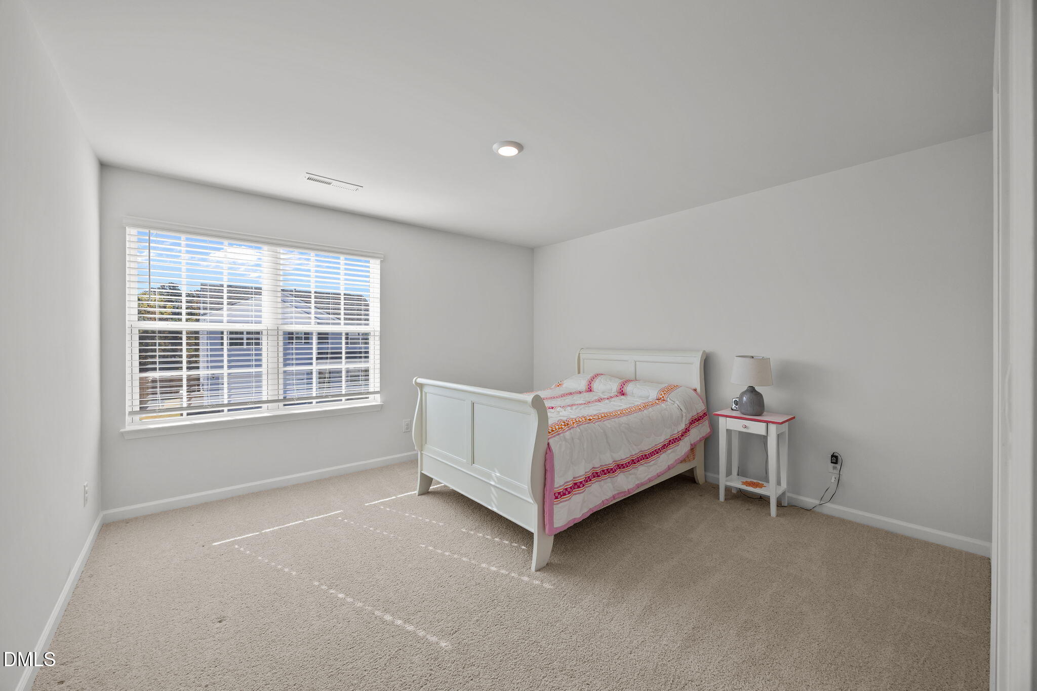 2117 Fletchers Ridge Drive Durham, NC 27703 - Photo 29 of 46 a bed room with a bed and a window