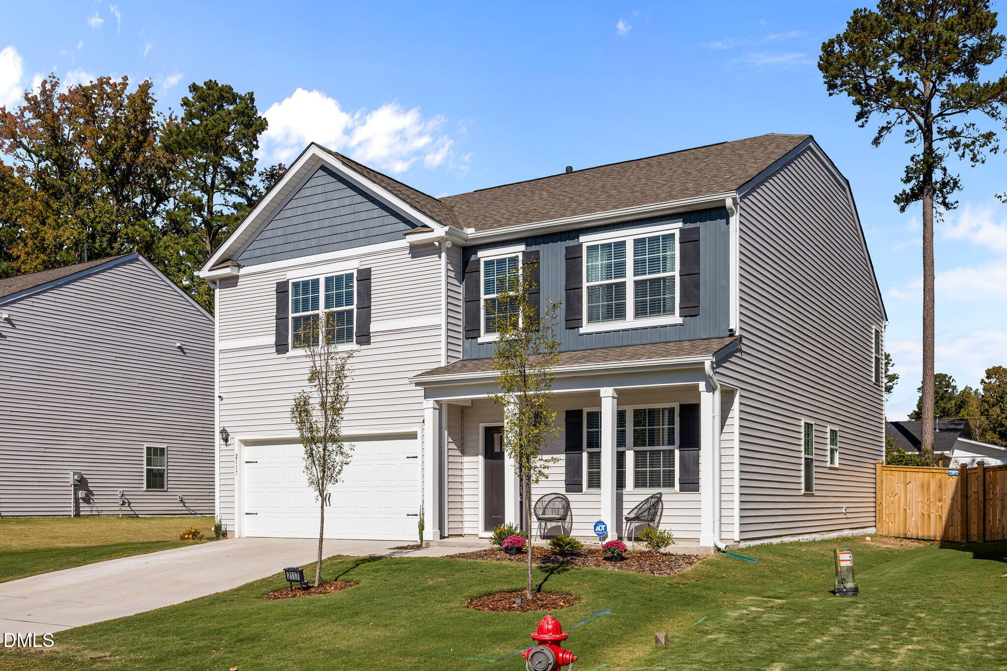 2117 Fletchers Ridge Drive Durham, NC 27703 - Photo 3 of 46 a front view of a house with a yard