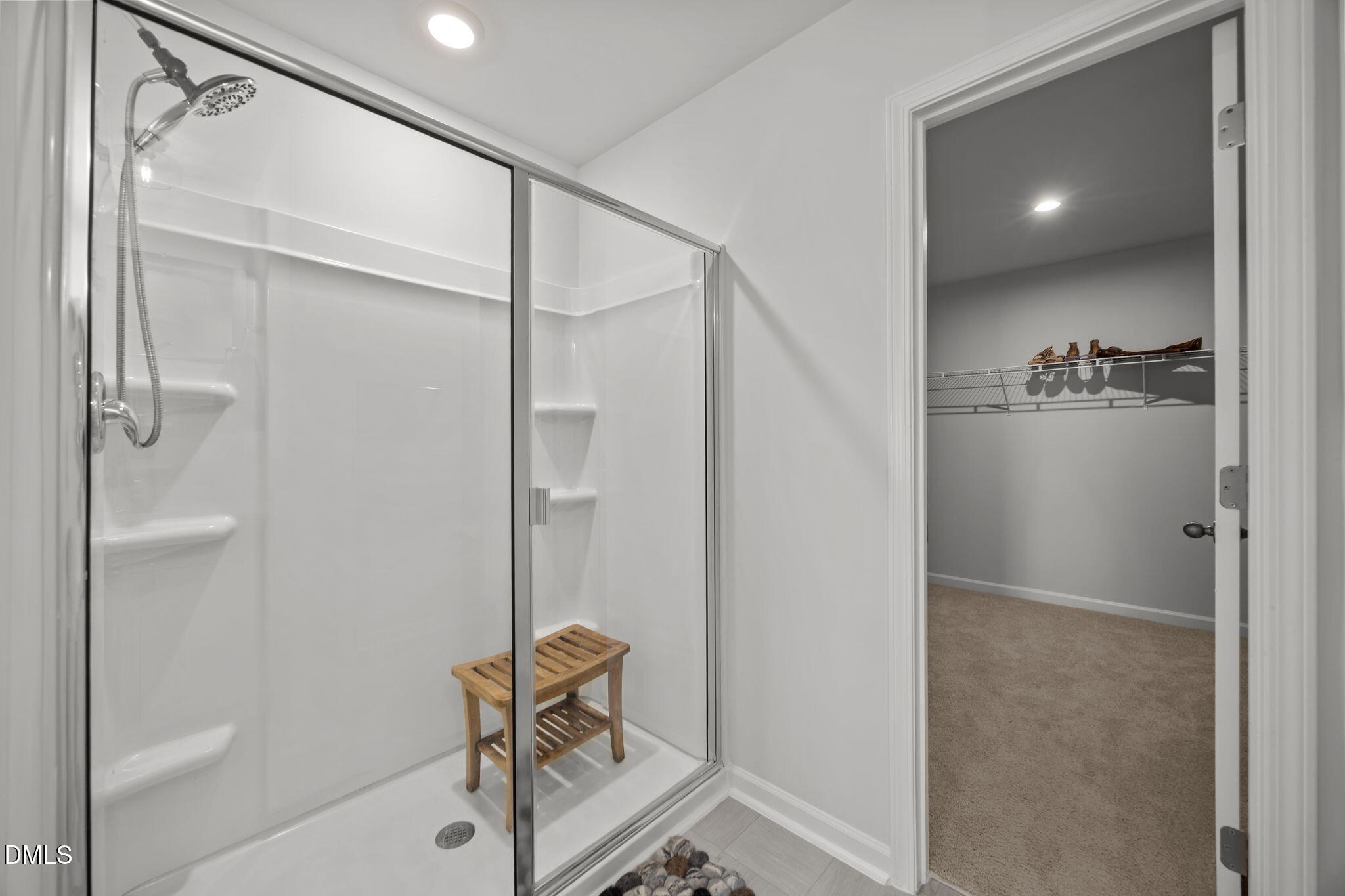 2117 Fletchers Ridge Drive Durham, NC 27703 - Photo 34 of 46 a bathroom with a shower and a mirror