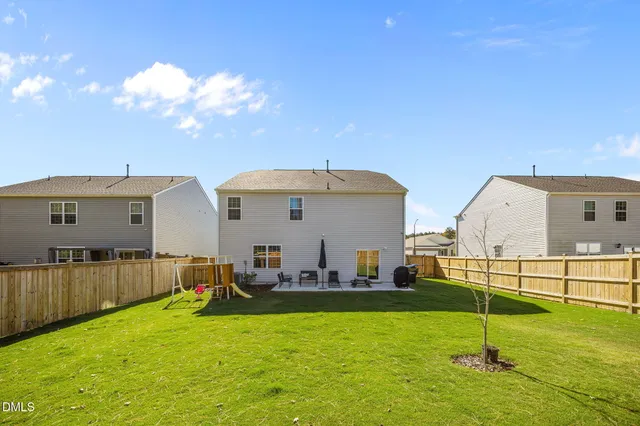 a view of a backyard of the house