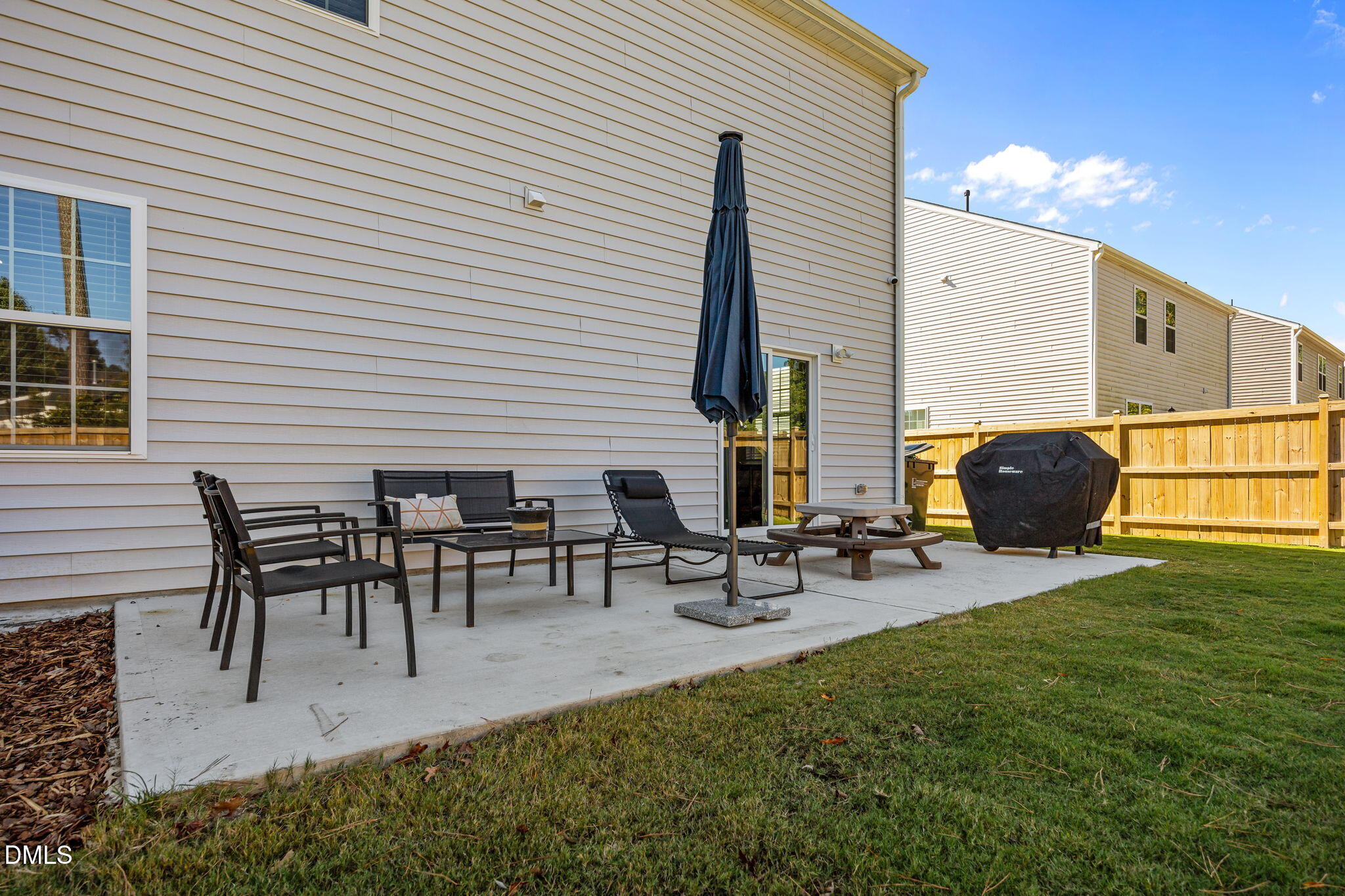 2117 Fletchers Ridge Drive Durham, NC 27703 - Photo 41 of 46 a view of a patio with table and chairs with wooden floor and fence