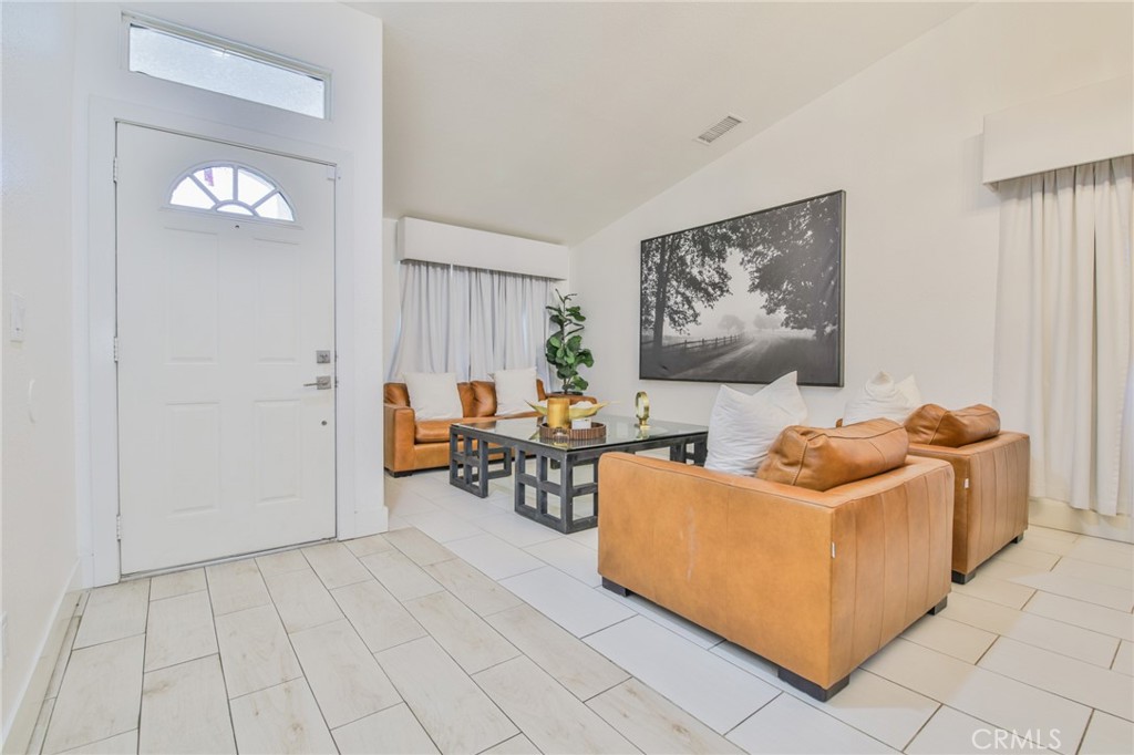 7925 Victor Avenue Hesperia, CA 92345 - Photo 11 of 23 a living room with furniture and a table