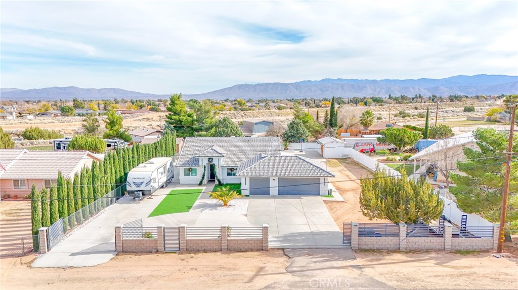 7925 Victor Avenue Hesperia, CA 92345 - Photo 2 of 23 an aerial view of a house with a ocean view