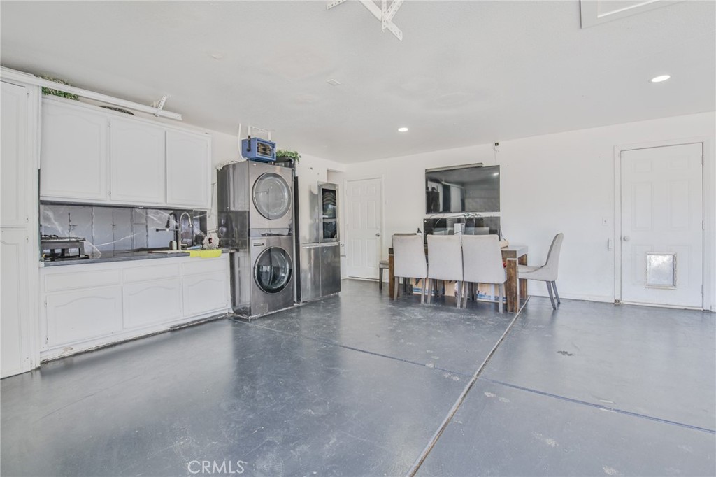 7925 Victor Avenue Hesperia, CA 92345 - Photo 22 of 23 a utility room with cabinets dryer and washer