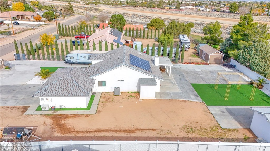 7925 Victor Avenue Hesperia, CA 92345 - Photo 7 of 23 an aerial view of a house with a garden and patio
