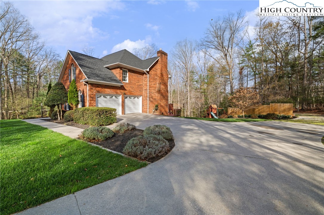 458 Jim Caudill Road Wilkesboro, NC 28697 - Photo 5 of 50 a view of a house with a yard