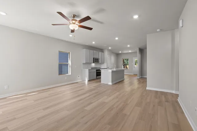 a view of kitchen with cabinets and wooden floor