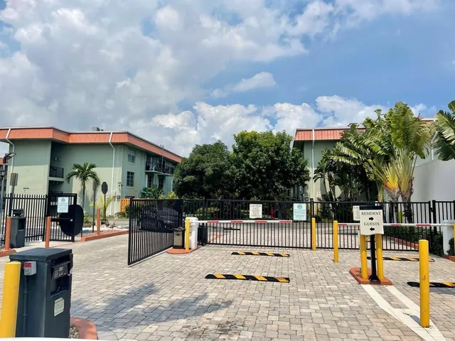 a swimming pool with a bench in front of it