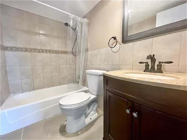 a bathroom with a sink a toilet and a bathtub