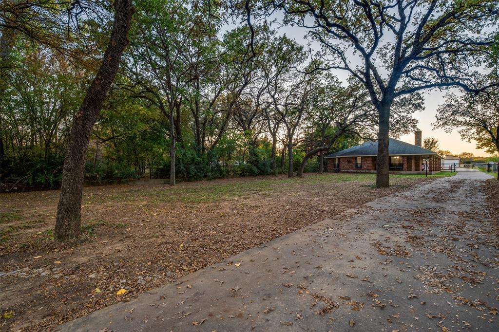 131 Cunningham Road Denton, TX 76208 - Photo 2 of 40 a view of backyard with green space