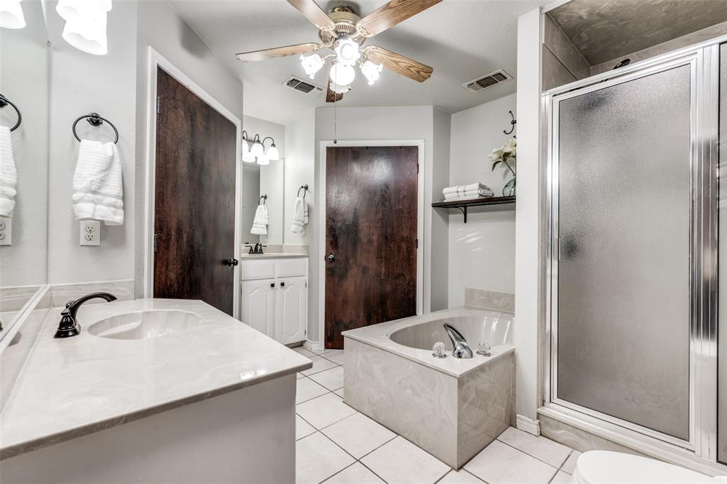 131 Cunningham Road Denton, TX 76208 - Photo 21 of 40 a bathroom with a sink toilet and shower