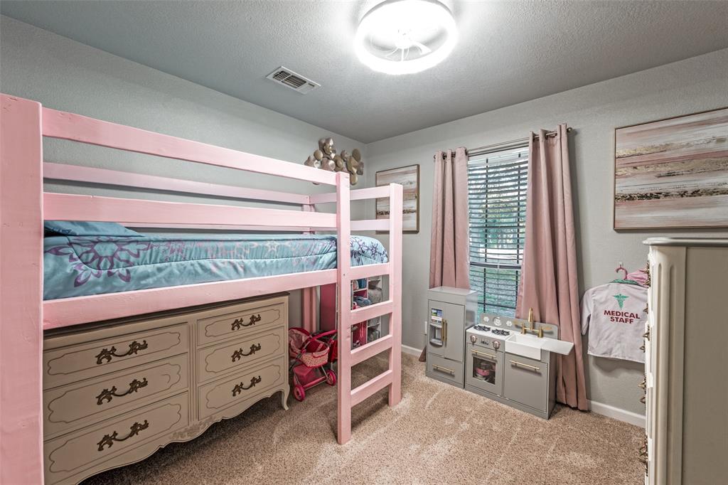 131 Cunningham Road Denton, TX 76208 - Photo 26 of 40 a view of a bedroom with workspace