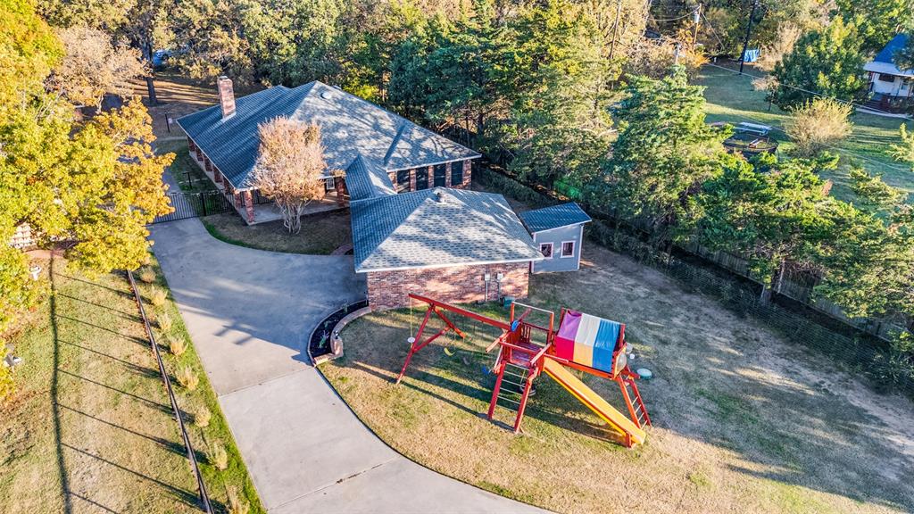 131 Cunningham Road Denton, TX 76208 - Photo 27 of 40 an aerial view of a houses with yard