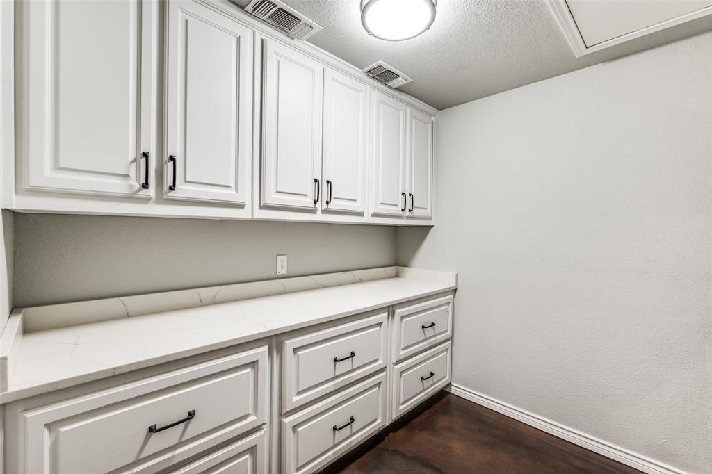 131 Cunningham Road Denton, TX 76208 - Photo 32 of 40 a view of cabinets and wooden floor