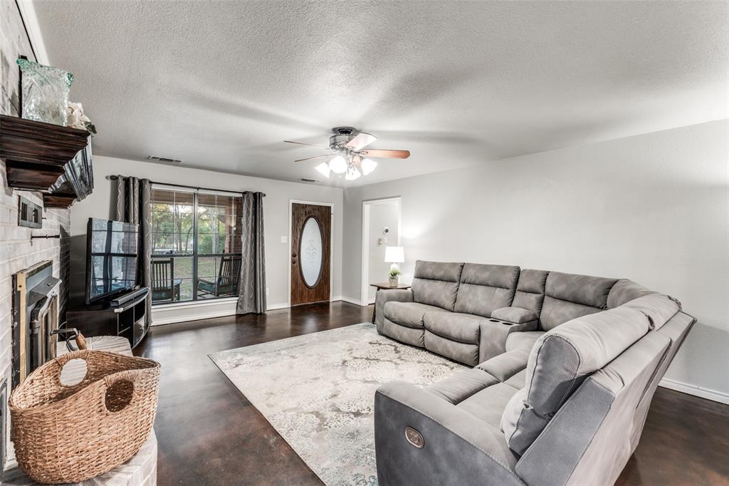 131 Cunningham Road Denton, TX 76208 - Photo 6 of 40 a living room with furniture and a flat screen tv