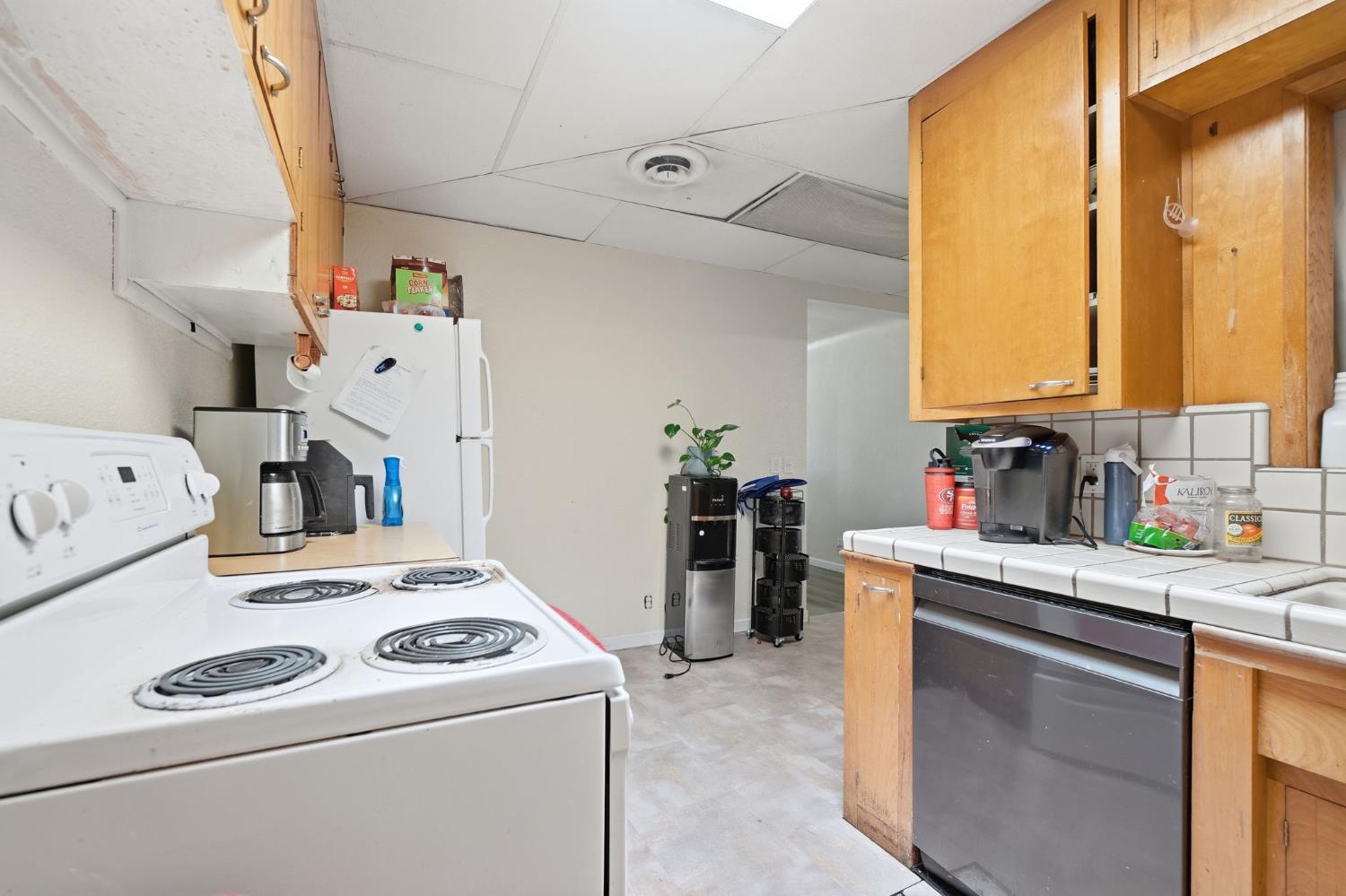 1705 Stetson Avenue Modesto, CA 95350 - Photo 16 of 32 a kitchen that has a sink and a stove in it