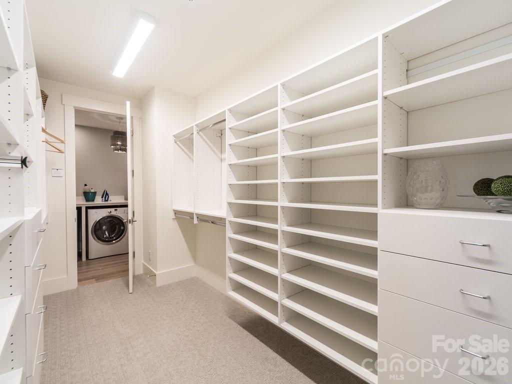 110 Willow Vw Loop Davidson, NC 28036 - Photo 26 of 42 a view of walk in closet with clothes and shoes