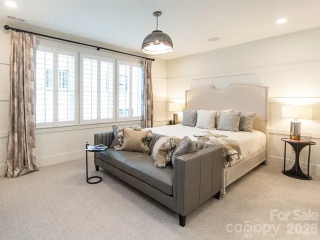 a room with table and a rug